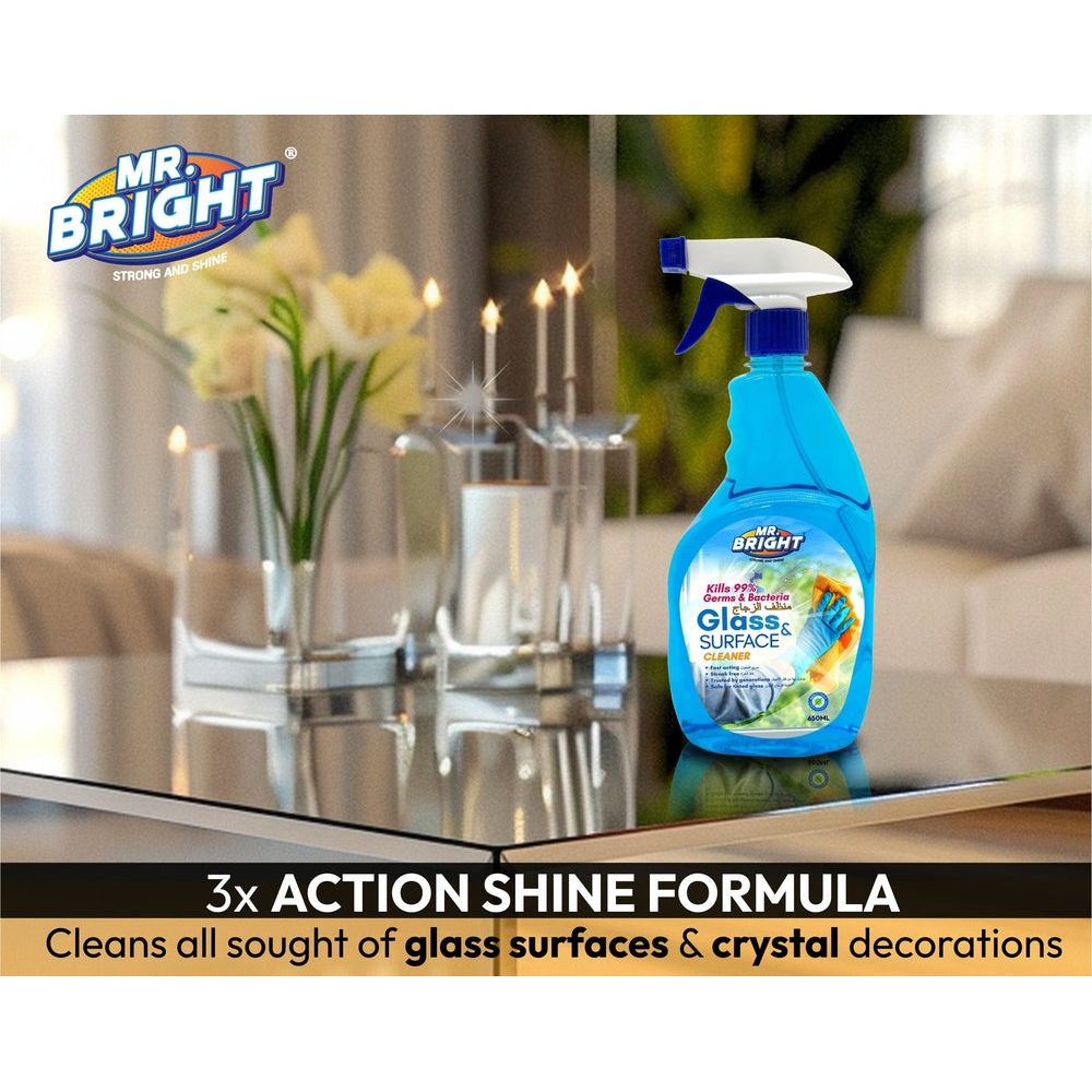 Mr Bright Glass & Surface Cleaner bottle on table with candles and flowers in background showcasing 3x Action Shine Formula