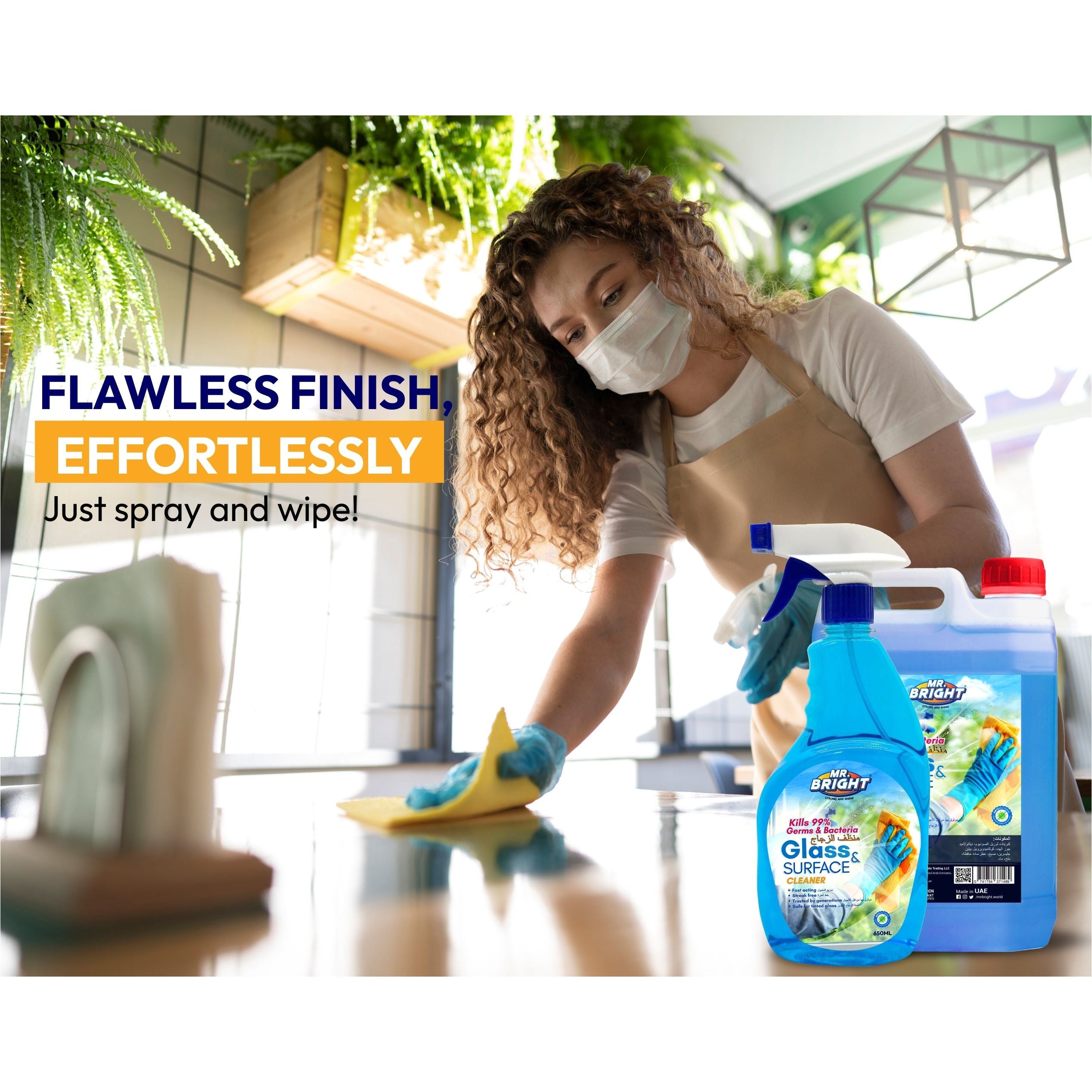 Woman cleaning table with Mr Bright Glass & Surface Cleaner 750ML for sparkling, streak-free finish.